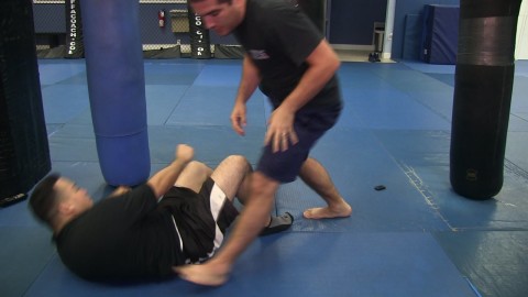 Standing toe hold counter to bottom guard leg lock